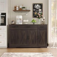 a kitchen with white cabinets and wooden floors, including a coffee machine on the counter