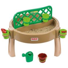 a toy sand and water table with green plastic cups on it's legs,