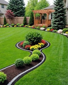 a garden with green grass and flowers in the middle