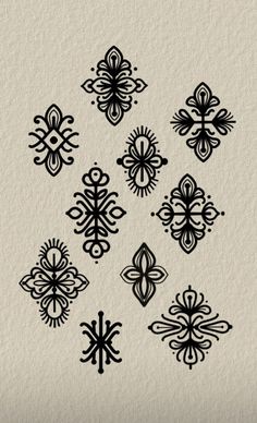 an image of some black and white designs on a piece of paper with watermarks