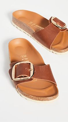 Leather: Cowhide Molded cork footbed with leather lining Narrow fit Adjustable buckle strap EVA sole Made in Germany This item cannot be gift-boxed | Birkenstock Madrid Big Buckle Sandals Bercanstock Sandals, Cognac Outfit, Madrid Birkenstock, Madrid Big Buckle, Birkenstock Madrid Big Buckle, German Dress, Brown Flats, Birkenstock Sandals, Leather Sandals Flat