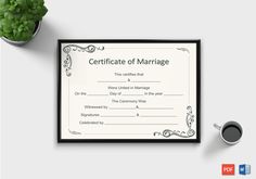 a certificate for marriage on a table next to a potted plant and coffee cup