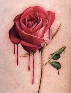 a red rose with dripping blood on it's lower back side ribcage