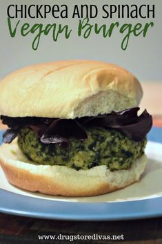 a close up of a sandwich on a plate with the words chicken and spinach vegan burger