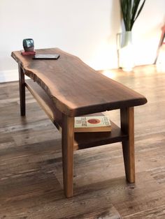 a wooden table sitting on top of a hard wood floor