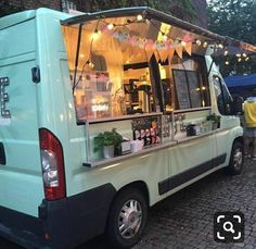 an ice cream truck is parked on the street