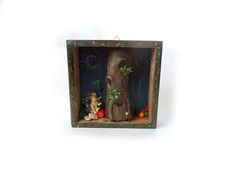 a small wooden box with an image of a tree trunk and gnomes in it