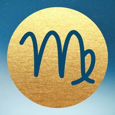 a golden circle with the letter m on it