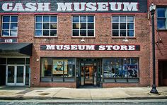 an old brick building with the words cash museum written on it's front window