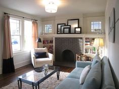 a living room filled with furniture and a fire place