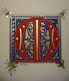 an ornately decorated letter with gold and blue accents