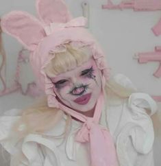 a woman with bunny ears and makeup on