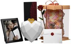 an assortment of wedding gifts including a card box, photo frame and flower bouquets