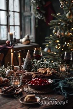 a table set for christmas with candles, cookies and cranberries