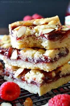 raspberry almond bars stacked on top of each other