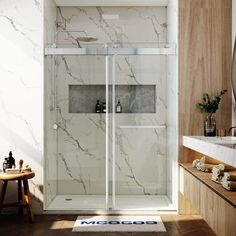 a bathroom with marbled walls and flooring, including a walk - in shower