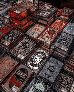 many wooden boxes are stacked on top of each other in this artistic photo, with the lids open