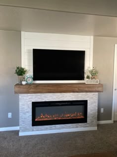 a fireplace with a flat screen tv above it