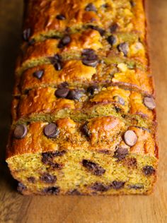 a loaf of chocolate chip banana bread on a wooden table