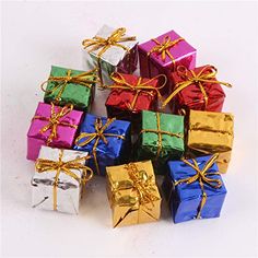 many different colored wrapped presents tied with gold ribbon