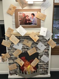 a fire place covered in notes and pictures