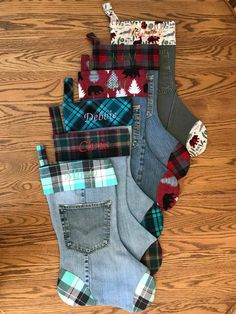 five pairs of women's socks sitting on top of a wooden floor