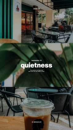 a cup of coffee sitting on top of a wooden table next to a green plant