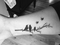 two birds sitting on a branch tattoo