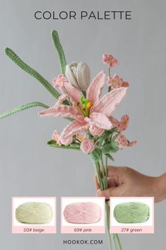 a hand holding a bouquet of flowers with three different colors on the bottom and side