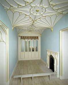 an empty room with blue walls and white trim on the ceiling is pictured in this image