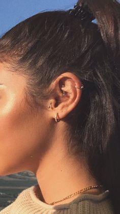 a woman with ear piercings on her ears