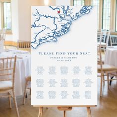 a white sign sitting on top of a wooden easel in front of a table