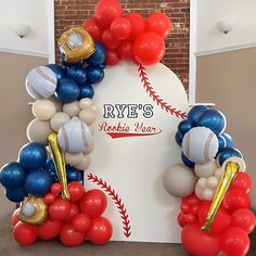 balloons and baseballs are arranged in the shape of a sign for rye's sports year