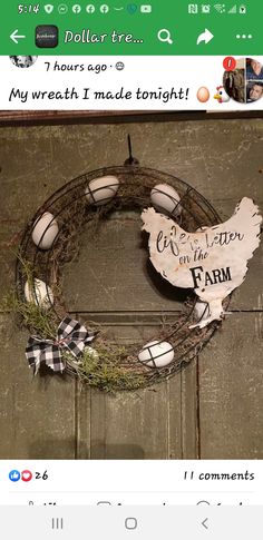 an image of a chicken wreath on the front door to someone's farm house