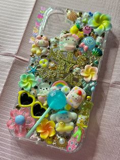 an iphone case with many different items on it