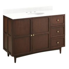 a bathroom vanity with a white counter top and wooden drawers on one side, and a sink on the other