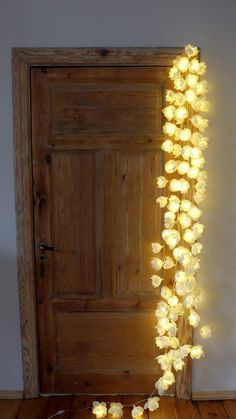 a door is decorated with flowers and lights