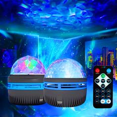 two disco balls with remote controls in front of a blue background