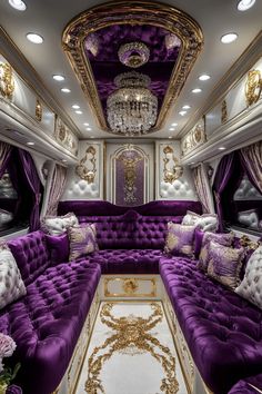 a luxurious living room with purple couches and chandeliers in the ceiling area