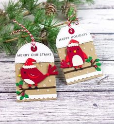 two christmas tags with red birds on them