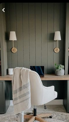 a chair with a blanket on it sitting in front of a desk