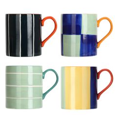 four different colored coffee mugs sitting next to each other