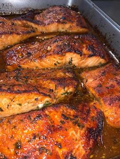 some meat is cooking in a pan on the stove