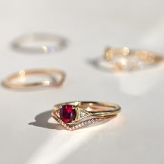 A romantic ruby, set between Jennie Kwon�s signature milgrain-edged triangles. Classic, with modern touches: a 21st century ring. See "Details" for item specifics (carat weight, metal, etc) Luxury Ruby Birthstone Ring For Wedding, Luxury Stackable Ruby Ring, Timeless Ruby Ring With Rose Cut Diamonds For Wedding, Elegant Stackable Ruby Ring For Formal Occasions, Red Rose Cut Diamond Wedding Ring, Elegant Red Stackable Rings, Timeless Anniversary Ruby Ring, Formal Stackable Ruby Jewelry, Luxury Ruby Marquise Cut Rings