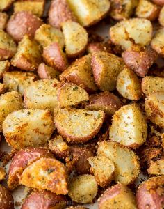 closeup of cooked potatoes with seasoning sprinkled on the top and bottom