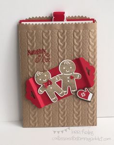 a close up of a greeting card with two gingerbreads