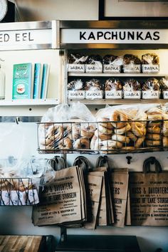 bagels and other goods are on display in a bakery