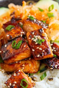 chicken with sesame seeds and rice in a bowl