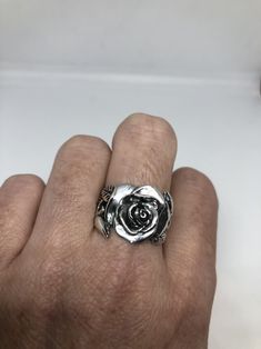 Lovely and delicate Rose flower ring 925 Sterling silver with black rhodium Size 8 or 8.75 can be re sized for you on request. My jeweler charges $10 All rings are shipped in a nice gift box. Check out our over a THOUSAND great reviews Engraving is $4 per letter and is not always perfect depending on the piece. It can take a few days if the jeweler is busy. This is payable to Paypal Judithsltd@gmail.com Elegant Silver Rings With Rose Details, Silver Rose Design Ring, Silver Ring With Rose Design, Rose Design Open Ring Jewelry Gift, Silver Jewelry With Roses For Gift, Sterling Silver Rose Flower Ring With Rose Design, Silver Promise Ring With Roses Detail, Silver Rose Ring Jewelry, Silver Rings With Rose Design