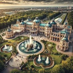 an aerial view of a large building with fountains